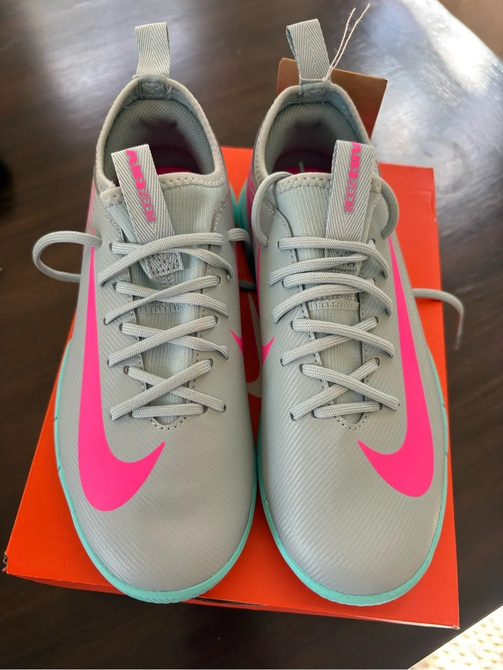 Nike kids Light blue indoor soccer shoes with Pink Accent